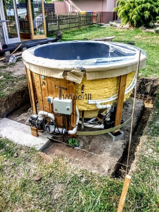 Built-in hot tub with electric heating and concealed technical equipment requiring permanent service access