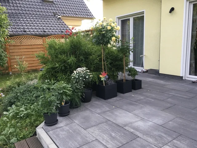 Preparing the Base for a Hot Tub or Outdoor Sauna 4 Planted garden corner beside a house terrace before preparing a hot-tub base