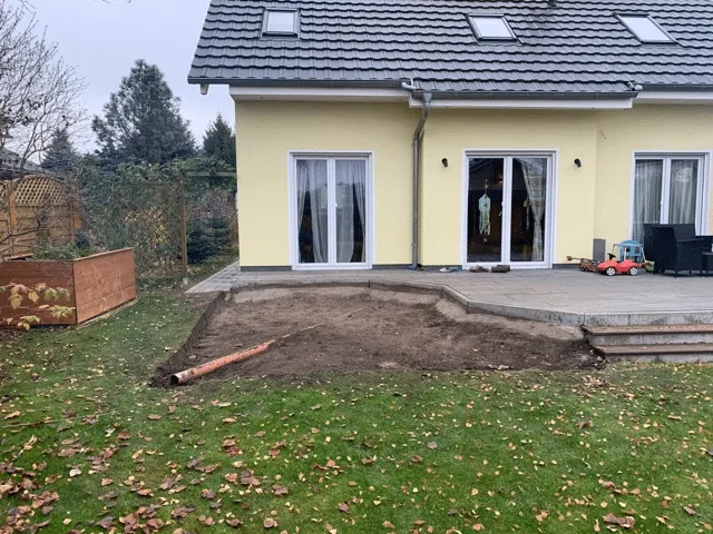 Preparing the Base for a Hot Tub or Outdoor Sauna 5 Cleared garden area beside a terrace after plants and topsoil were removed