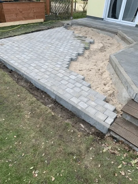 Preparing the Base for a Hot Tub or Outdoor Sauna 8 Newly laid paving on the prepared hot-tub base beside a house terrace