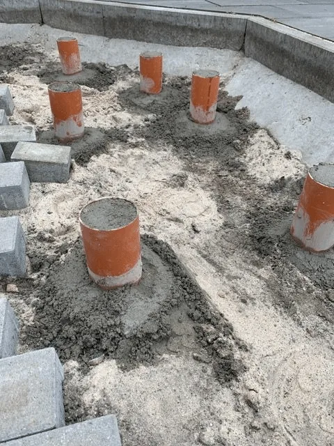 Preparing the Base for a Hot Tub or Outdoor Sauna 9 Prepared concrete point supports in gravel for a timber terrace around a hot tub