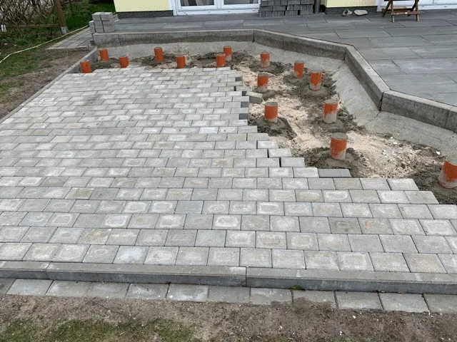 Preparing the Base for a Hot Tub or Outdoor Sauna 10 Paved hot-tub area with support points prepared for an adjoining timber terrace