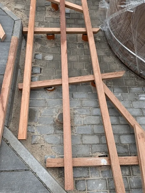 Preparing the Base for a Hot Tub or Outdoor Sauna 12 Open timber subframe for a narrow terrace walkway beside a round hot tub