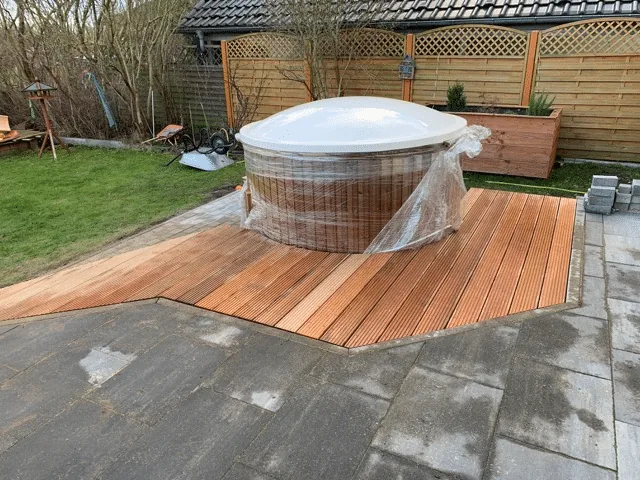 Preparing the Base for a Hot Tub or Outdoor Sauna 15 Completed TimberIN hot tub integrated into a raised timber garden terrace with access walkway