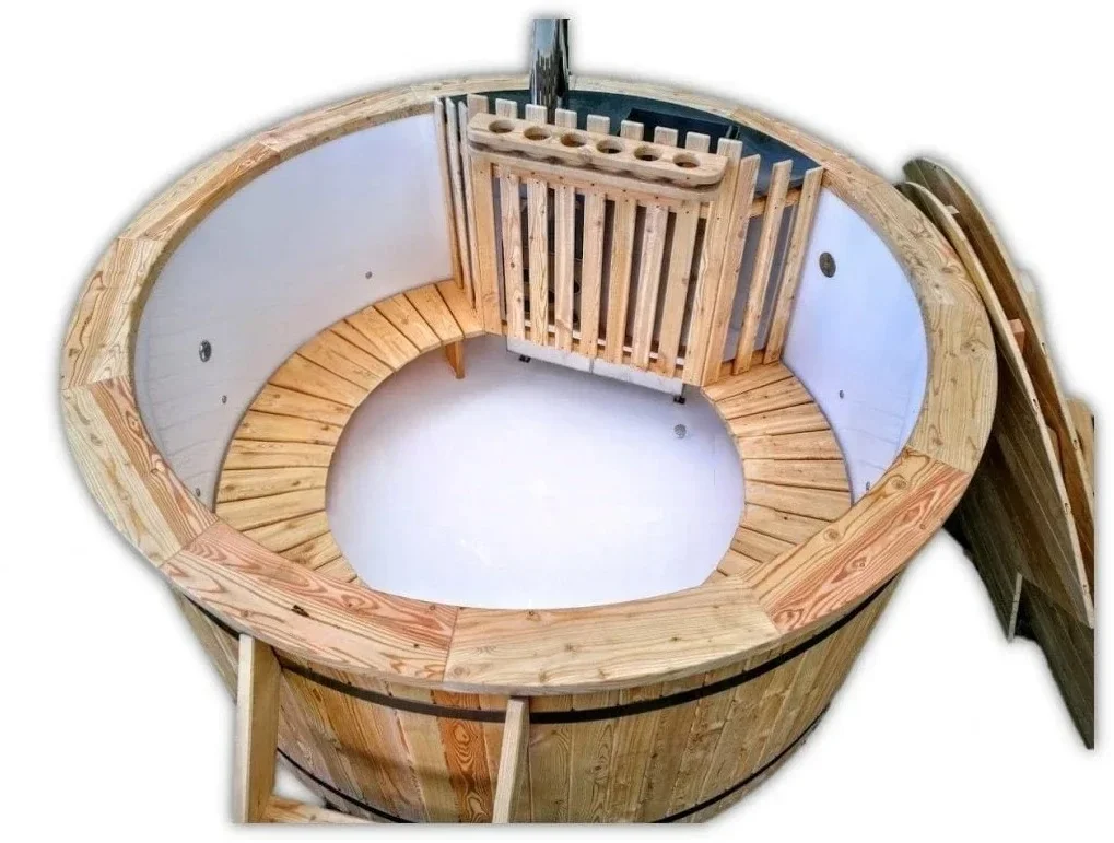 Types of Wood for Hot Tubs & Outdoor Saunas 2 Pale Nordic spruce on the rim, seating and heater guard of a round TimberIN hot tub with a white liner