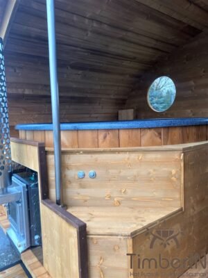 Outdoor oval sauna with an integrated hot tub (16)