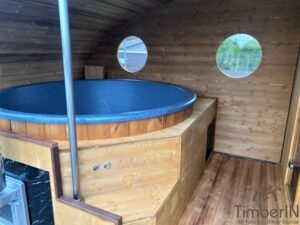 Outdoor oval sauna with an integrated hot tub (17)