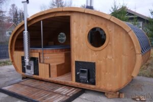 Outdoor oval sauna with an integrated hot tub (72)