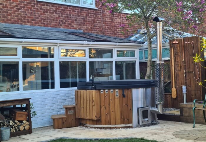 Wood burning hot tub for UK garden heating with logs