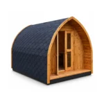TimberIN Glamp Pod™ – arched timber glamping pod with black shingle roof, glazed double doors and small covered porch on a white background.