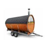TimberIN Nordic Nomad™ Mobile Barrel Sauna – mobile barrel sauna with thermowood body, panoramic glazed front, wood-fired chimney and twin-axle road trailer on a white background.