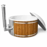 4 Person Hot Tubs 2 TimberIN Nordic Core round hot tub with white liner, thermowood cladding, integrated wood heater, stainless-steel chimney and open insulated cover on a white background.