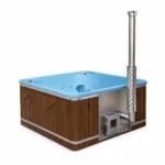 4 Person Hot Tubs 14 Large 8 Person Wood Fired Hot Tub – TimberIN Nordic Elite™ Square – large square wood-fired hot tub with blue moulded liner, timber-and-dark-panel exterior, integrated heater and tall stainless-steel chimney on a white background.
