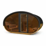 Prices 7 TimberIN Nordic Hobbiton™ Glass – wide oval Hobbit-style sauna with dark shingle shell, panoramic glazed front, central glass door and curved timber benches on a white background.
