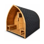 TimberIN Nordic Pod™ Custom – arched garden sauna pod with timber façade, glazed door, sheltered entrance benches and black shingle roof on a white background.