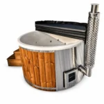 4 Person Hot Tubs 1 TimberIN Nordic Rojal hot tub with grey fibreglass liner, massage jets, thermowood cladding, integrated stainless-steel wood stove, chimney, wooden steps and black insulated cover on a white background.