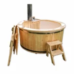4 Person Hot Tubs 12 4 Person Wood Fired Hot Tub – Compact Snorkel Stove Design – round wooden hot tub with pale liner, internal snorkel stove, tall chimney, wooden steps, ladder and paddle on a white background.