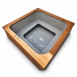 4 Person Hot Tubs 5 TimberIN Nordic Square hot tub with grey moulded liner, wraparound bench, recessed footwell and massage jets on a white background.