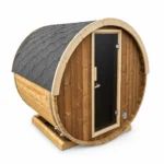 TimberIN Nordic Terrace™ 160 Electric – compact two-person terrace barrel sauna with pale timber cladding, grey shingle roof and full-height glazed entrance door on a white background.