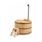 4 Person Hot Tubs 10 Wooden Hot Tub Basic – TimberIN Nordic™ (Affordable Wood Fired Model) – round solid-timber hot tub with pale spruce staves, curved wooden benches, guarded internal wood stove, chimney, timber steps and matching wooden lid on a white background.