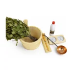 Harvia Sauna Set – sauna accessory set with wooden bucket and ladle, birch whisk, thermometer and hygrometer, essential oil and copper bowl on a white background.