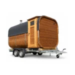TimberIN Nordic Square Mobile Sauna™ – square mobile sauna with rounded roof, timber cladding, glazed side door and twin-axle trailer chassis on a white background.