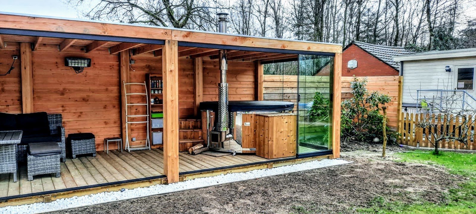 TimberIN UK 11 Wood-fired hot tub under a garden gazebo