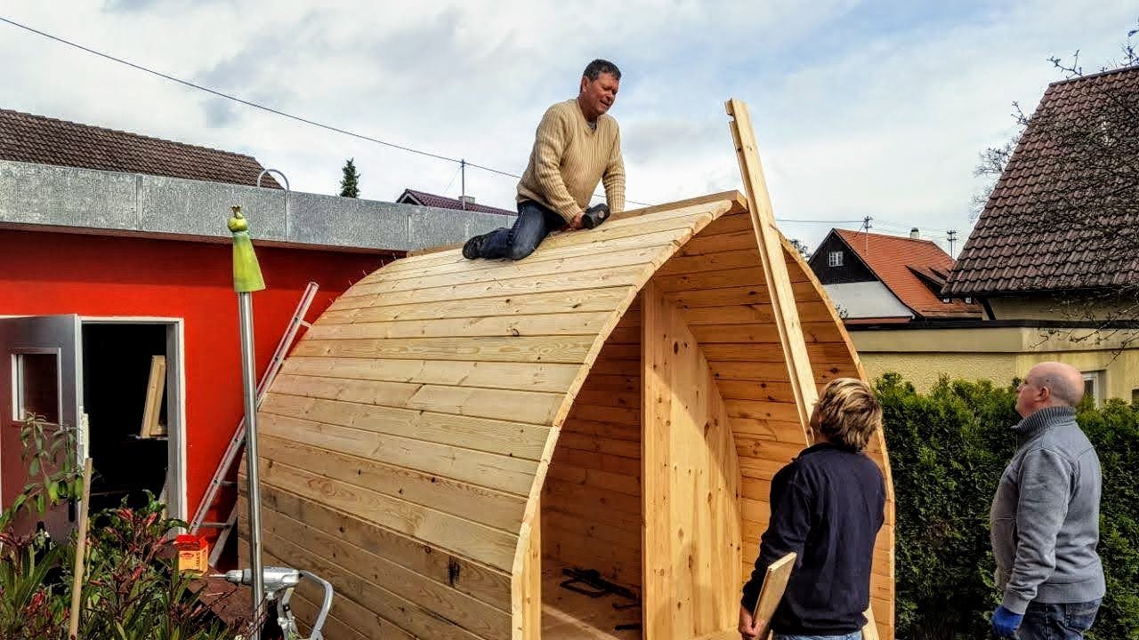TimberIN UK 14 Barrel sauna being assembled in a garden
