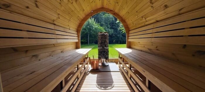 Timber benches inside a barrel sauna