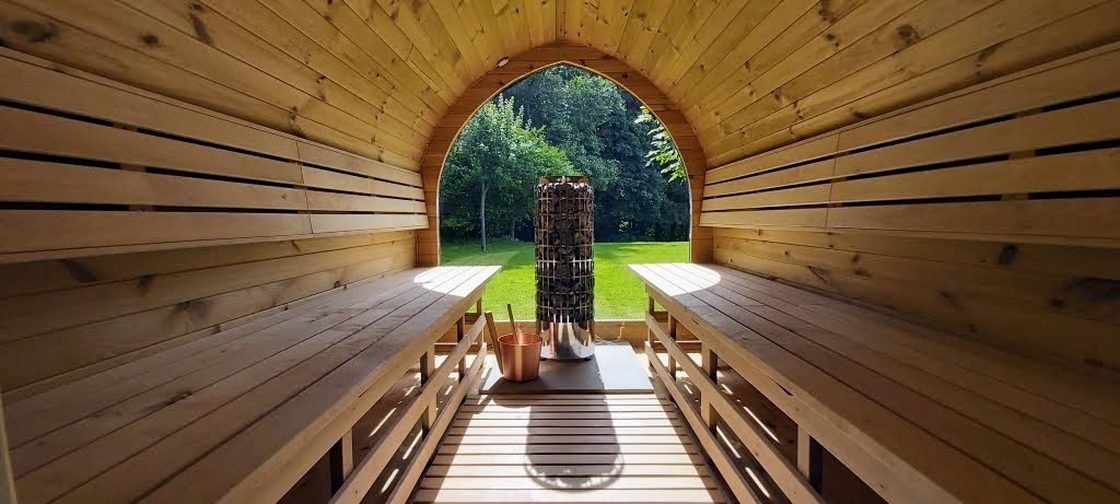 Timber benches inside a barrel sauna