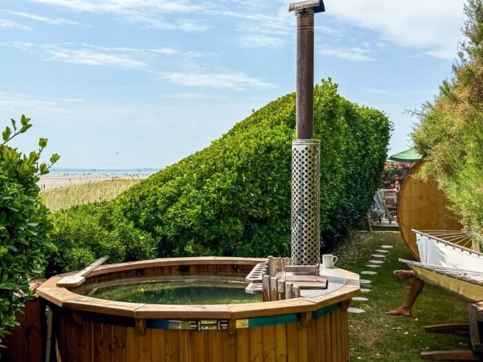 Traditional wooden hot tub with hoops and an internal heater