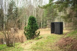 TimberIN Nordic Cube S black sauna at the forest edge