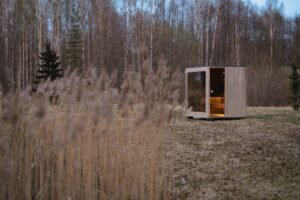 TimberIN Nordic Cube outdoor sauna by a lake
